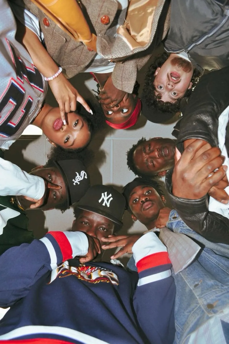 Friends in jerseys, fitted caps, and denim